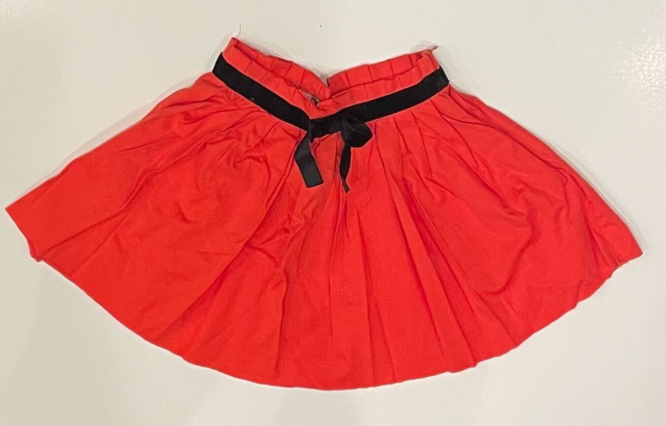 CORAL SHORT SKIRT WITH BLACK BOW
