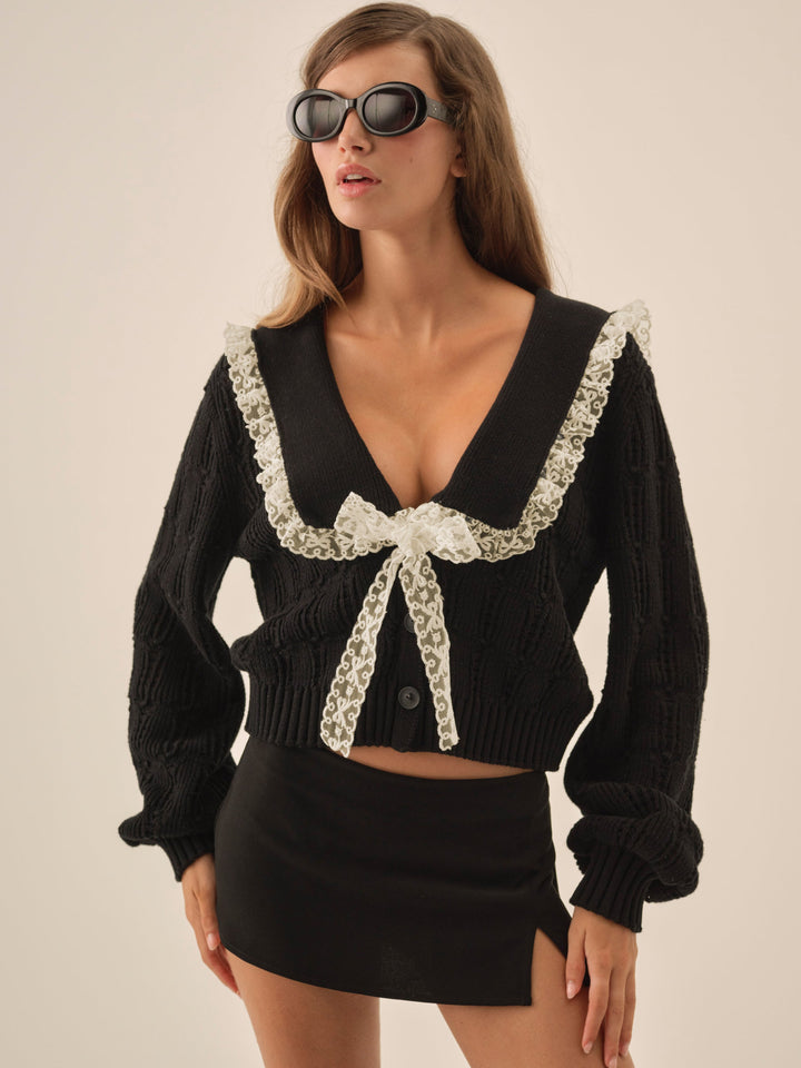 black sweater w/ thin gold collar